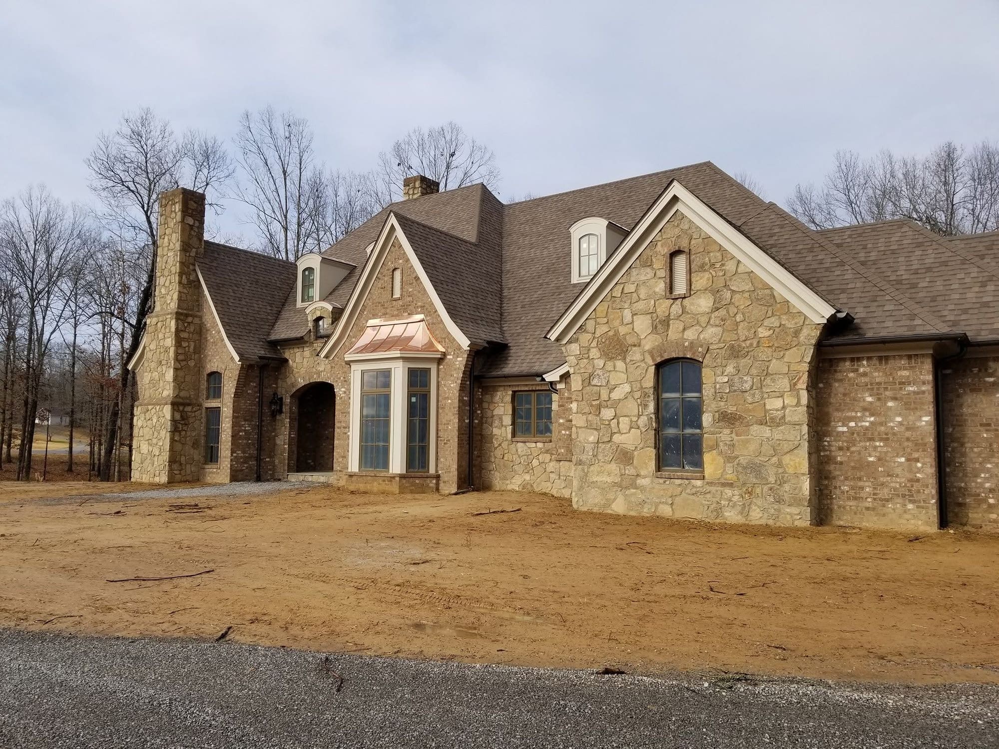 Stone home exterior, project photo supplied by Pope's Painting